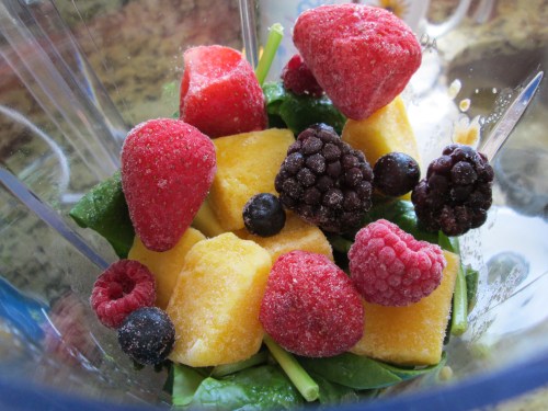 I added the juice to this colorful mix of spinach, berries, and mango in the blender.
