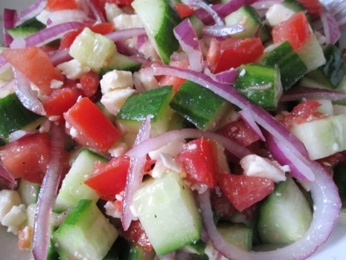 Greek salad made of cucumber, tomato, red onion, nonfat crumbled feta cheese, and lime juice. Yum!