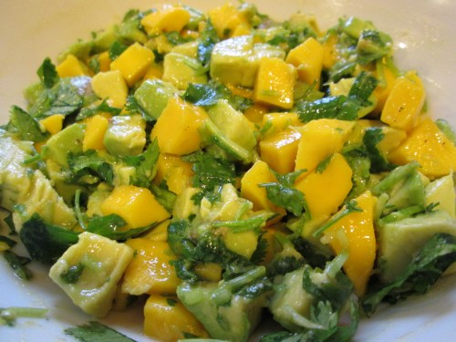 The salsa made with a mango, avocado, cilantro, and lime juice.