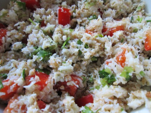 Crab meat mixed with breadcrumbs, olive oil, lime juice, salt, pepper, cilantro, red pepper, and garlic.